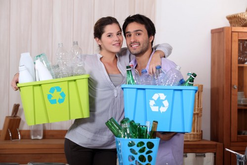 Volunteers sorting donations and recyclable items at a local recycling area